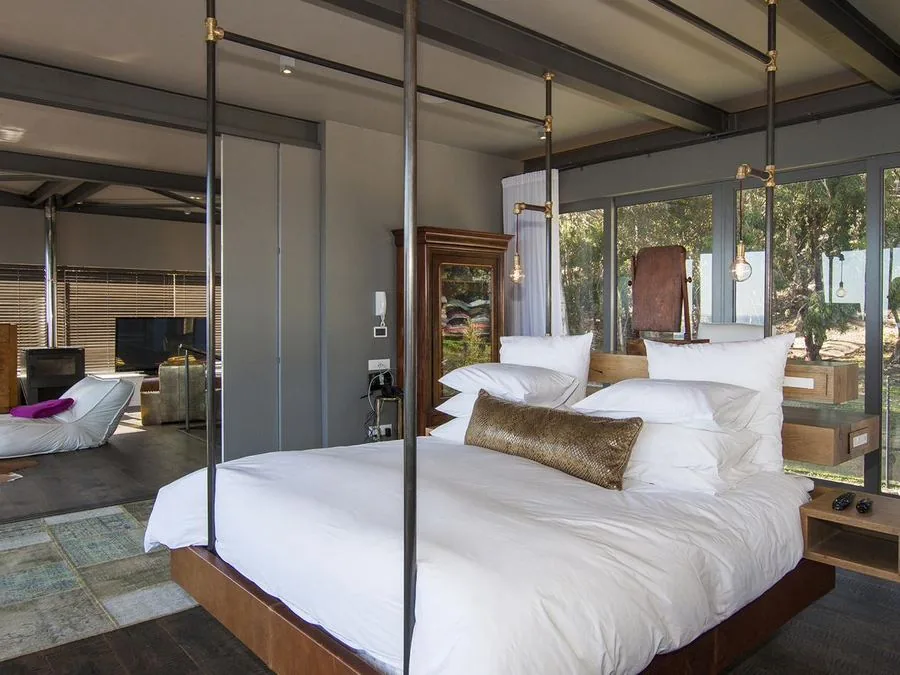 Suspended bed in a steel-framed main bedroom, Camps Bay and Clifton