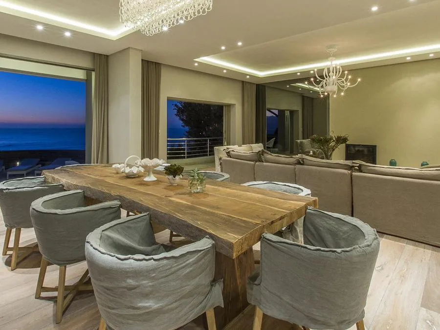 Dining and lounge area with sea views at dusk, Camps Bay and Clifton