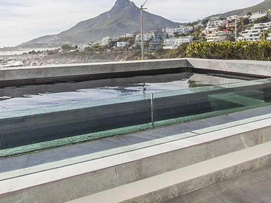 Rim-flow pool overlooking the coastline, Camps Bay and Clifton
